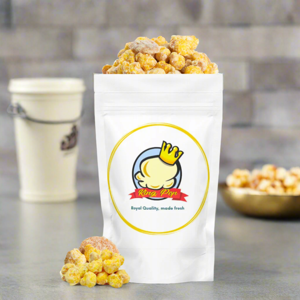 Gourmet banana pudding flavored popcorn with vanilla wafers in a gold bag, handcrafted snack from Winston Salem.