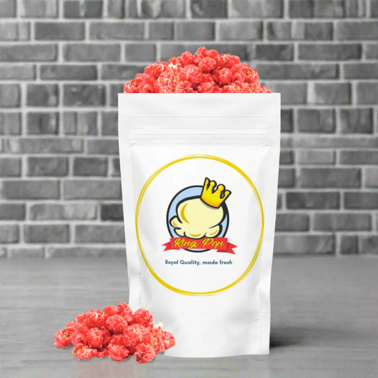 Gourmet strawberries and cream popcorn in gold bag, featuring handcrafted small batch snacks from Winston Salem.